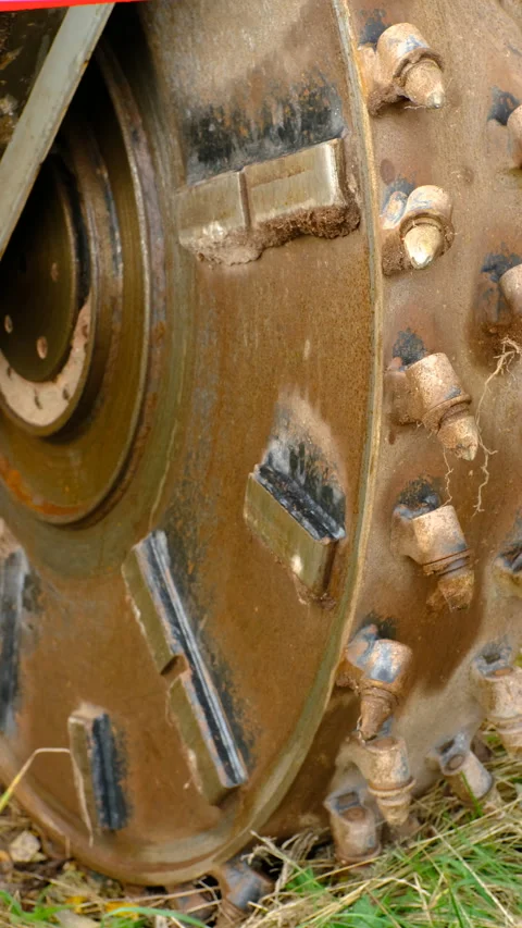 Close-up view of a rotating excavation cutter wheel of a heavy earthmoving machi Stock Footage 320670501