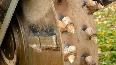 Close-up view of a rotating excavation cutter wheel of a heavy earthmoving machi Stock Footage 320670938