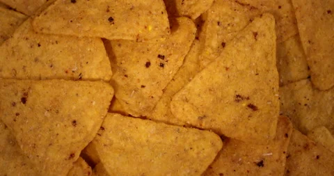 Close up view of rotating nacho chips. Filmed with RED camera. Stock Footage 155721003