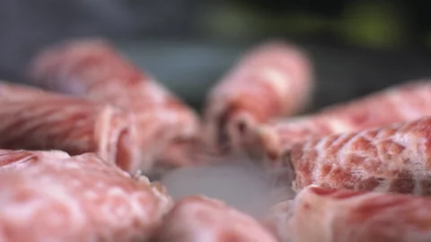Close-up view of rotating pieces of hotpot meat Stock Footage 157842841