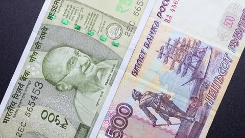 Close up view of rotating Russian ruble and Indian rupee banknotes. Stock Footage 309818072