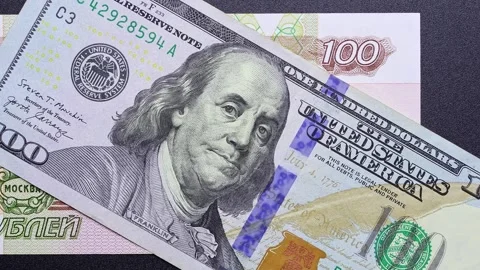 Close up view of rotating Russian ruble and American Dollar banknotes. Stock Footage 309823038