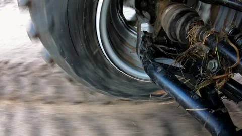 Close-up view of a rotating tire on a vehicle, showcasing the dynamic motion Stock Footage 321741702
