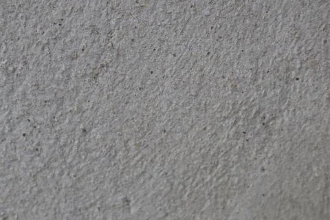 Close up view of a rough grey concrete wall texture Stock Photos