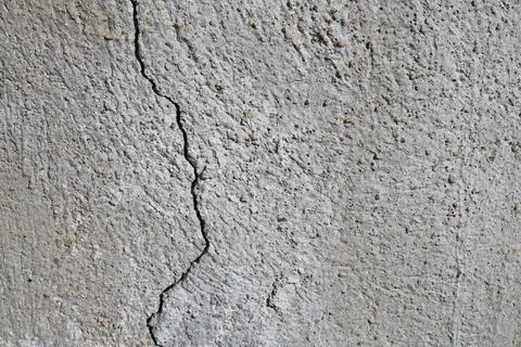 Close up view of a rough grey concrete wall texture Stock Photos
