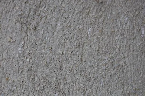 Close up view of a rough grey concrete wall texture Stock Photos