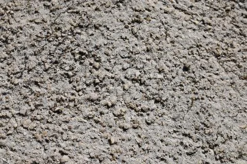 Close up view of a rough grey concrete wall texture Stock Photos