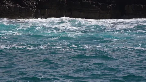 A close-up view of rough water crashing against the rocky shore Stock Footage 285967122