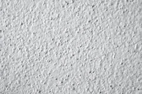 Close-up view of a roughcast plaster wall - photo texture perfect for 3D modelin Stock Photos