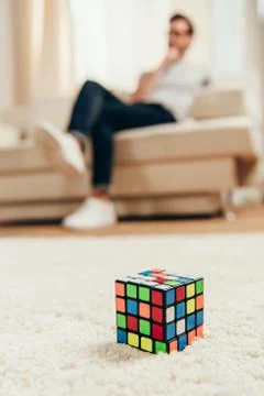 Close-up view of rubik cube on white carpet indoors Stock Photos