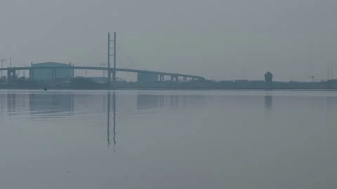 Close view of ruegen bridge and Shipyard stralsund on a dizzy morning in spring Stock Footage 332920456