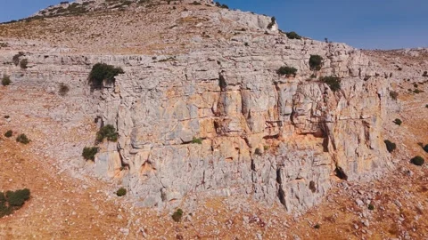 Close view of rugged cliff face and rocky slope 動画素材 331226390