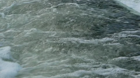 Close-up view of running and foaming water on the dam. Stock Footage 231070080