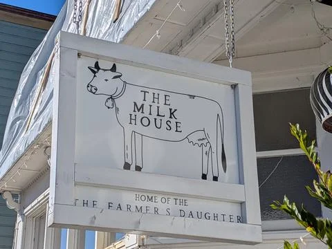 Close view of rustic sign reading “The Milk House Stock Photos