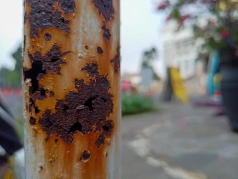 A close-up view of the rusting iron pole Stock Photos