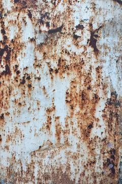 Close-up view of a rusty metal surface with natural corrosion patterns displa 스톡 사진