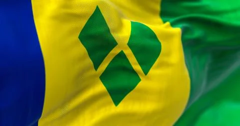 Close-up view of Saint Vincent and the Grenadines national flag waving Stock Illustration