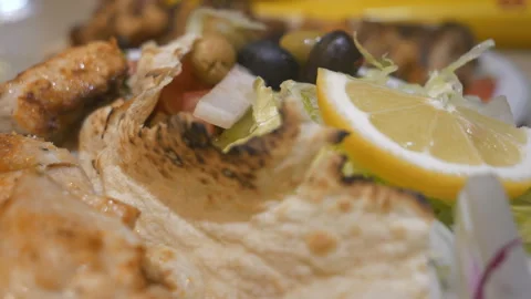 A close up view of a salad with chicken kebab. Stock Footage 120089101