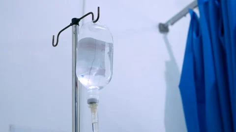 Close up view of saline IV drip bag and Infusion pump hanging on stainless .. Stock Footage 281576631