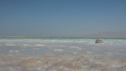 Close up view of salt crystals and mineral formation on the shore of Dead Sea in Stock-Footage 97828515