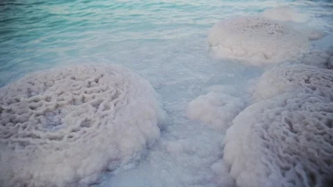 Close up view of salty rocks atol that is in the Dead Sea which is the lowest Stock Footage 181648704