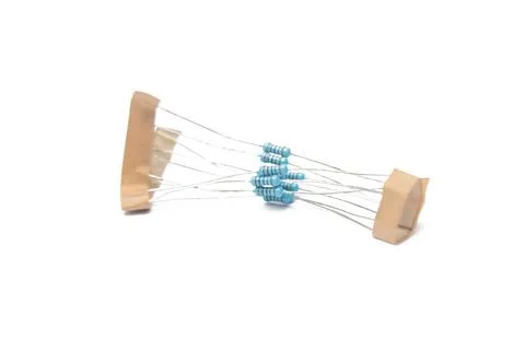 Close-up view of the same color coded blue resistor group on a white backgrou 写真素材