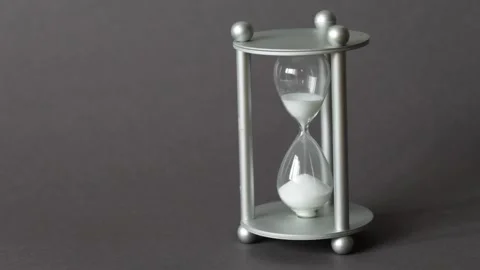Close up view on sandglass on dark background Stock Footage 198181239