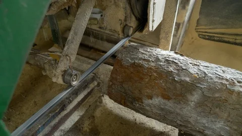A close up view of an sawmill machine, processing a log of wood at a wood Stock Footage 117109675