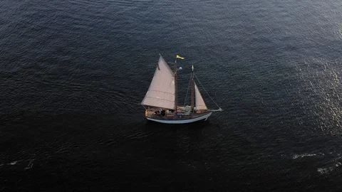 Close up view of schooner having a sail pulled down and tilting up to view Stock Footage 109175215