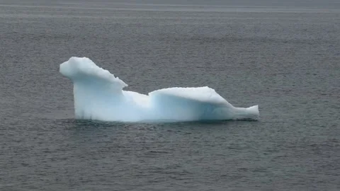 Close View of Sculpted Iceberg Floating Near Nuuk Greenland in 4K Stockbeeldmateriaal 345517152