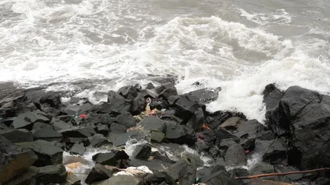 Close view of sea waves striking large rocks Video stock 191410373