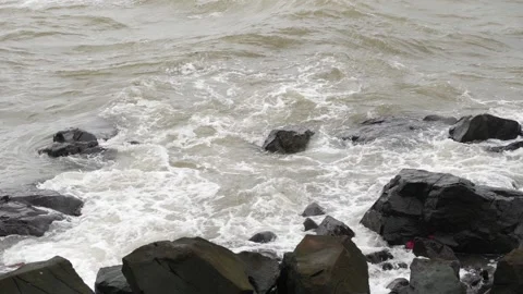 Close view of sea waves striking large rocks Stock Footage 191420621
