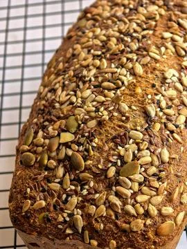 Close View Of Seeded Keto Bread On Cooling Rack Stock Photos