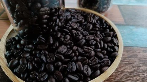 Close-up view, selective focus, coffee beans and in glass bottle Foto stock