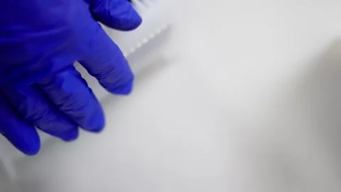 Close-up view of a semiconductor wafer cassette holding multiple thin silicon Stock Footage 325866787