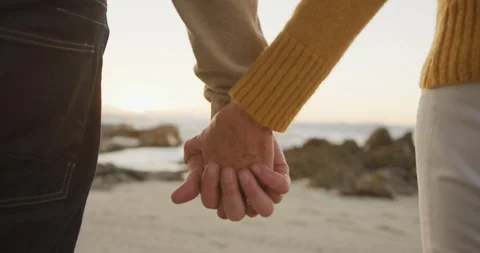 Close up view of senior couple holding hands at beach Video stock 123731048