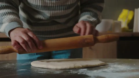 Close-up view of senior woman's hands baking pies in her home kitchen, rolling Stock Footage 239507006