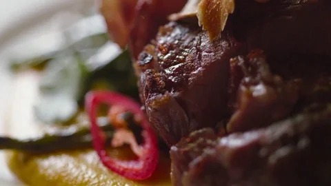 Close up view of a served grilled meat on the plate. Delicious food. Video stock 74624045