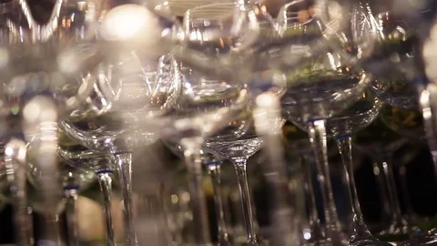 Close-up view on set of glasses with salad on high legs with blur bokeh lights. Stock-Footage 72603234