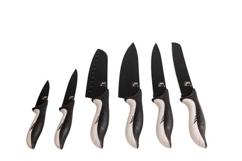 Close up view of set of kitchen knives isolated on white background. Stock Photos