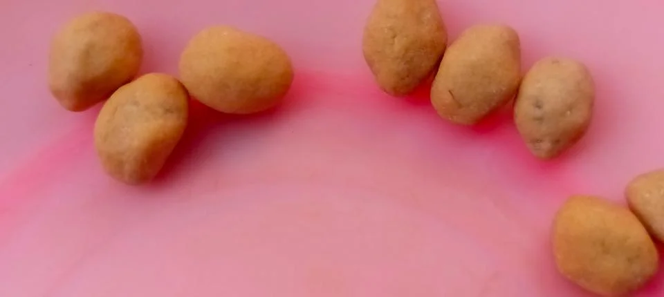 Close-up view of several crispy fried peanuts Photos