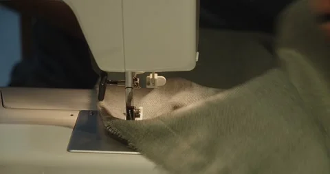 Close-up view of a sewing machine sewing clothes Stock Footage 242188365
