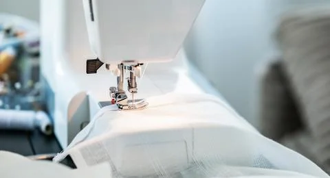 Close View of Sewing Machine Working on Fabric Stock Photos