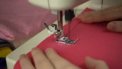 Close up view of sewing process in slow motion Stock Footage 100131594