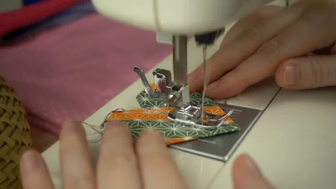 Close up view of sewing process in slow motion Stock Footage 100131976