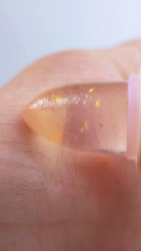 Close up view of shining or glossing palm using lip balm cosmetic product. .. Stock Footage 339156512