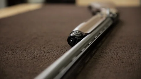Close-up view of shotgun on the table Stock Footage 92023993