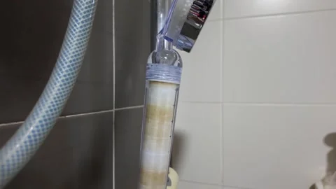 Close-up view of the shower head filtration system in the bathroom. Stockbeeldmateriaal 321634622
