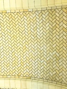A close-up view shows a ceiling covered in tiles arranged in a herringbone pa Fotos de archivo