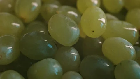 A close-up view shows a large quantity of green grapes grouped together in a Video stock 338297846